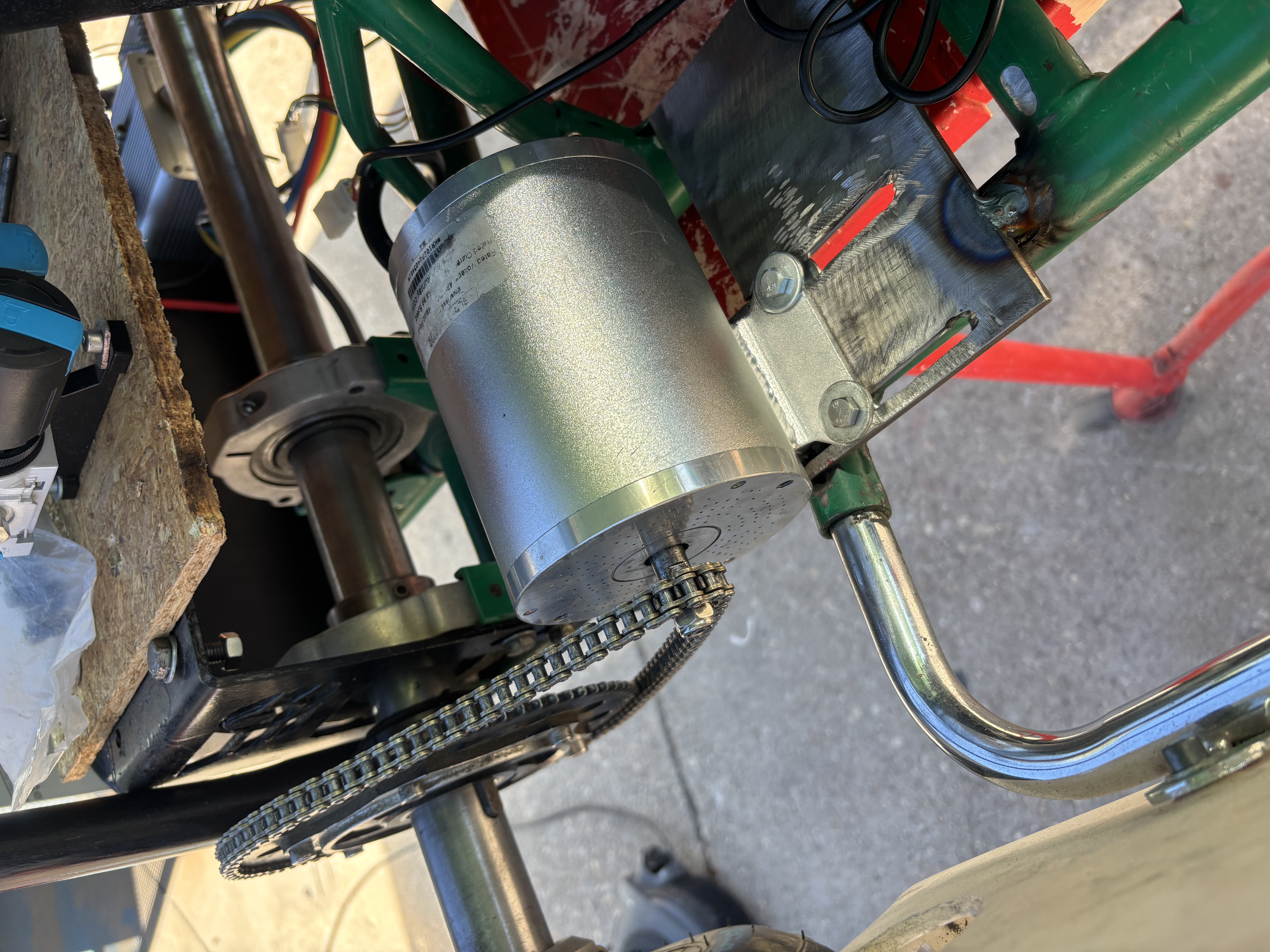 Motor mounted to the welded steel plate, with chain