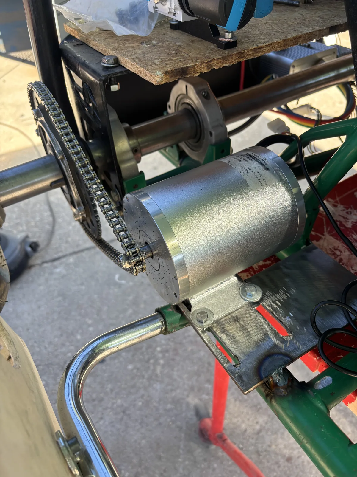 Motor mounted to the welded steel plate, with chain