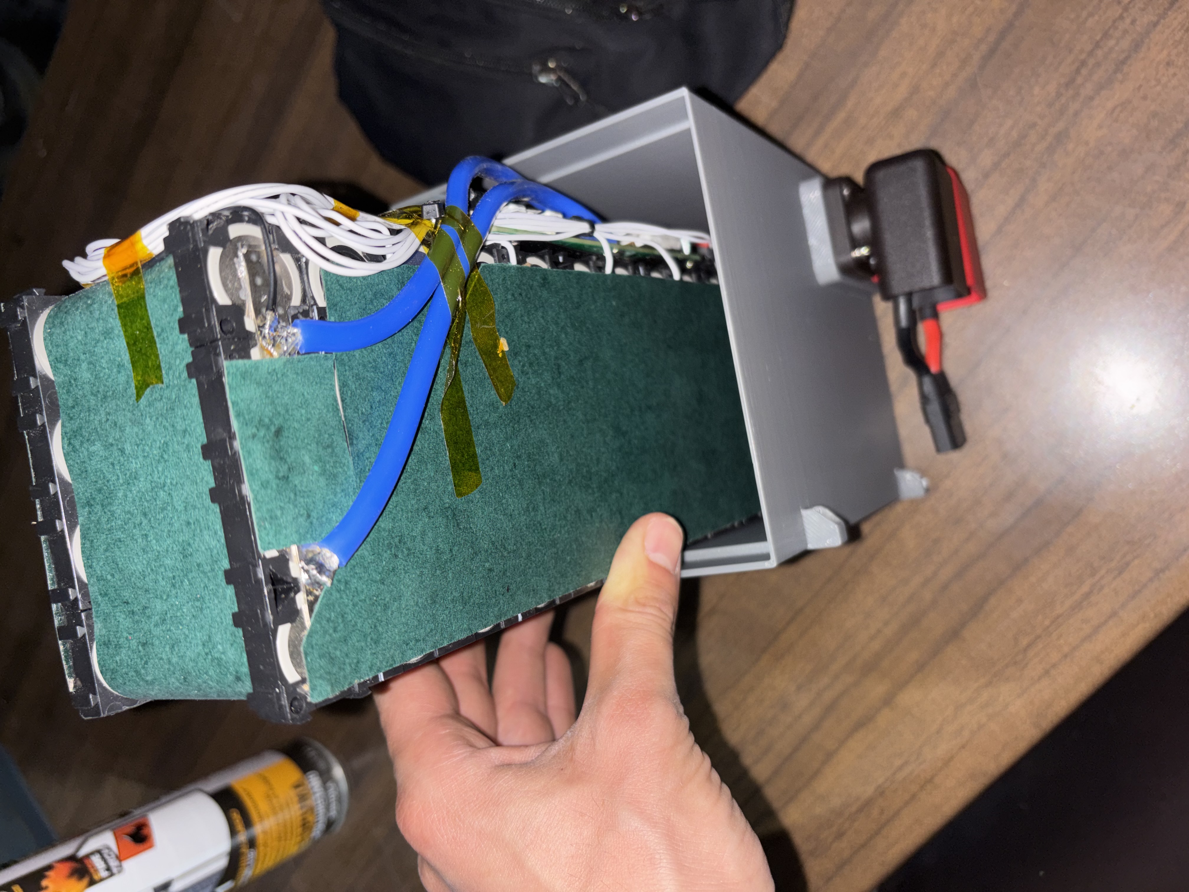 Lowering the pack into its 3D-printed enclosure