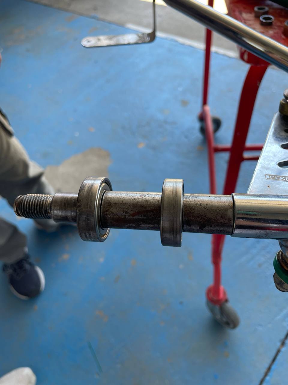The spacer on the axle, between the inner bearing races